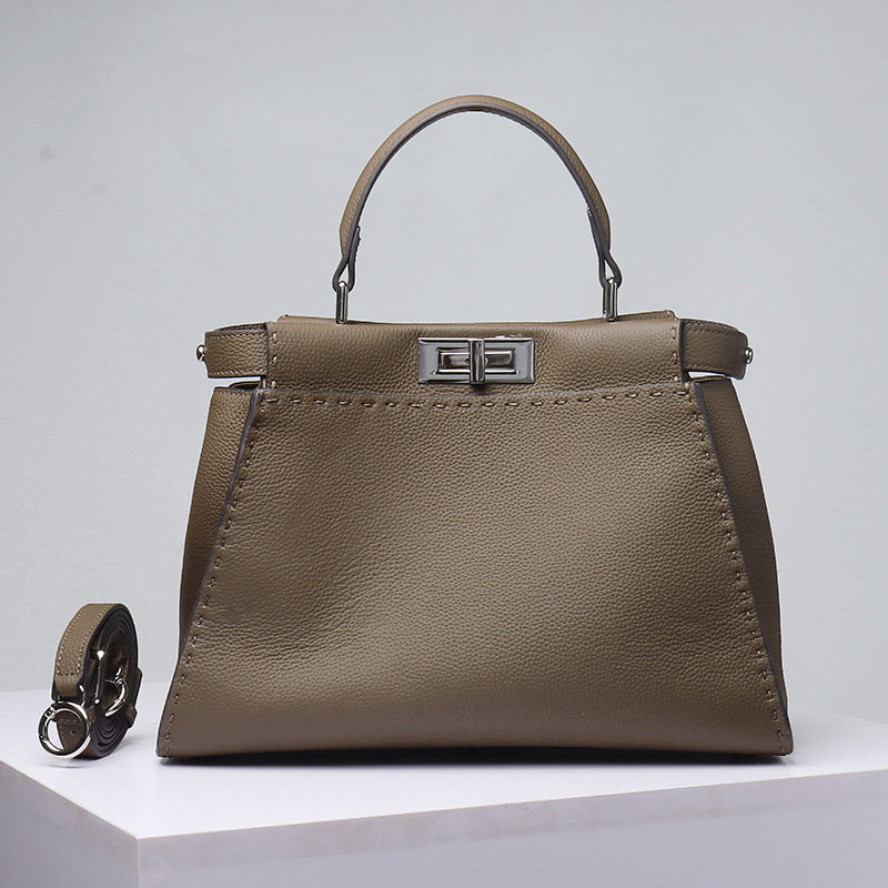 Li Ji | Original handmade leather | TOGO pebbled metal lock kitten bag No. FD001